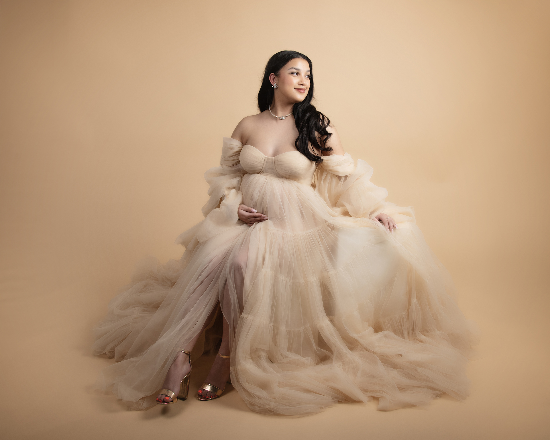 Pregnant woman in elegant gown maternity photoshoot in Bromley London